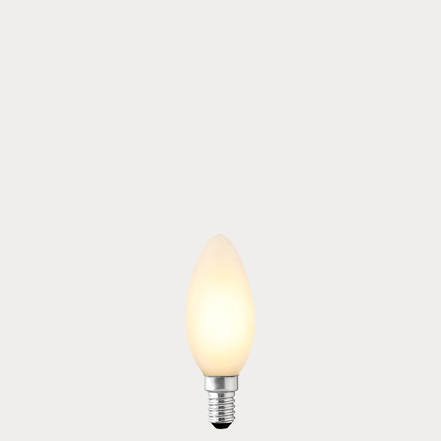 Dulora 4.2W Candle LED Bulb E14 Porcelain in Warm White, glowing with 2700K warm white light.